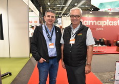 Roberto Saldana and Jim DiMenna with Red Sun Farms are walking the floor.